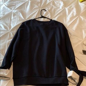 Dark blue crewneck with white ends and bow ties